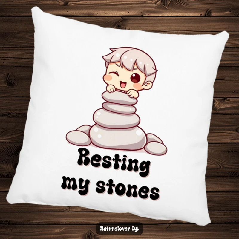 Funny pillow with a character winking while attempting to balance a pile of smooth stones, adding cozy zen vibes.