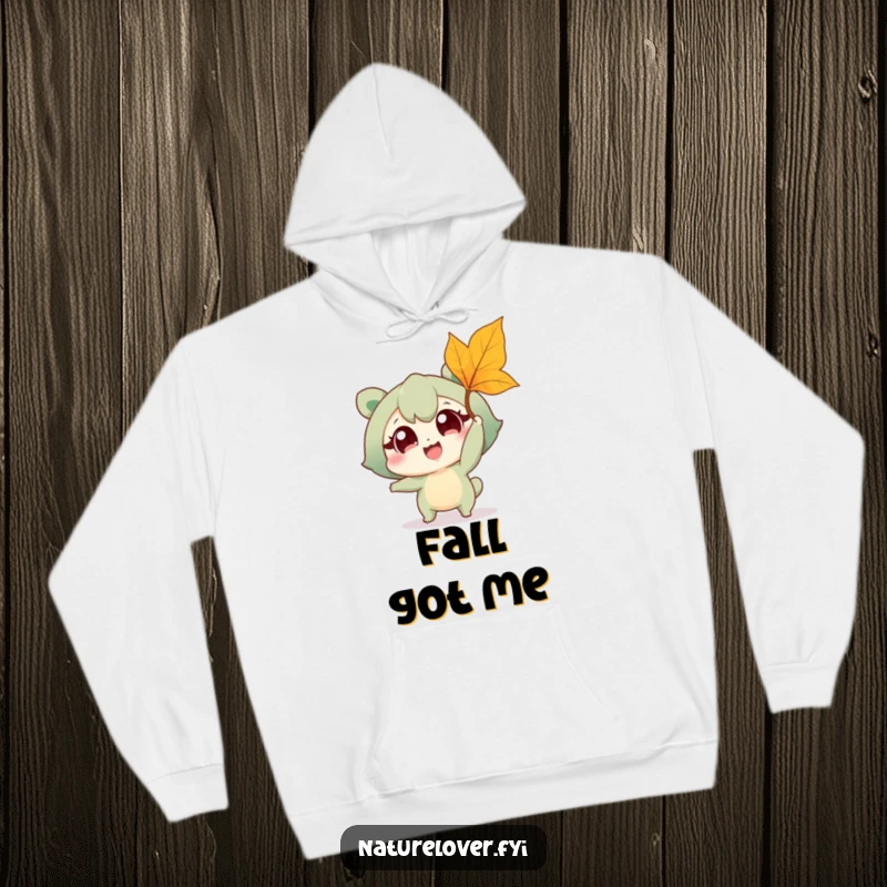 Funny hoodie showing a happy nature lover character joyfully reaching for a falling leaf, embodying outdoor fun and a love for autumn.