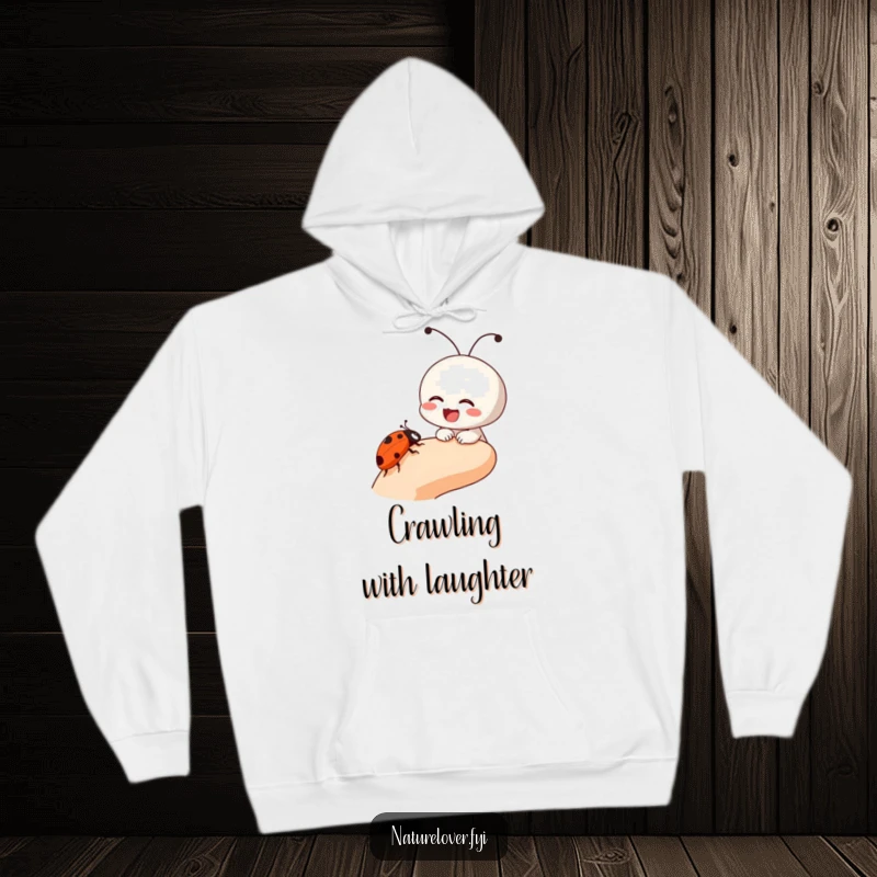 Funny hoodie with a small character laughing as a ladybug crawls on its finger, perfect for cozy, humorous moments.