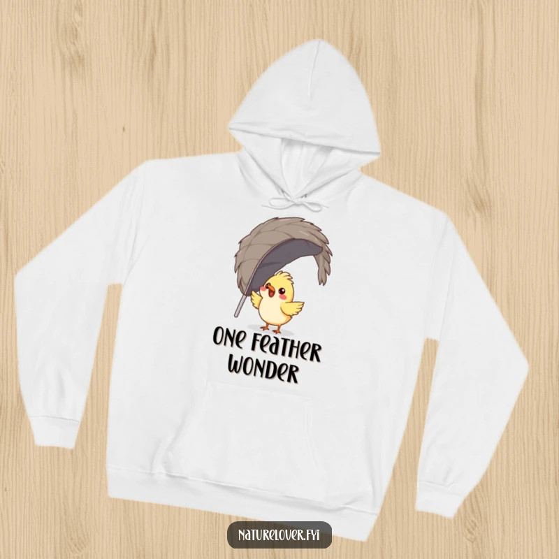 Funny bird hoodie depicting a gleeful bird attempting to build a nest out of a single, massive feather, cozy and amusing.