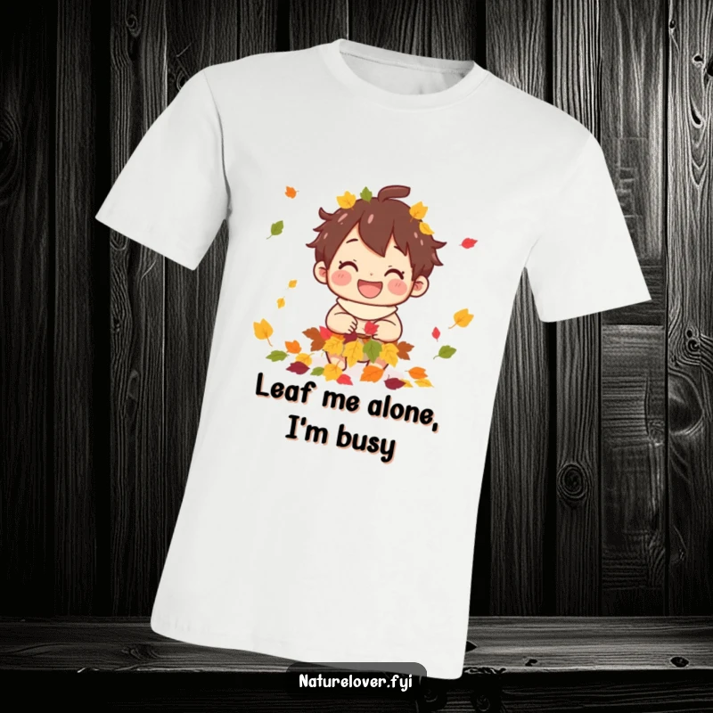 Funny t-shirt graphic of a smiling character collecting a pile of colorful fallen leaves, embodying autumn happiness.